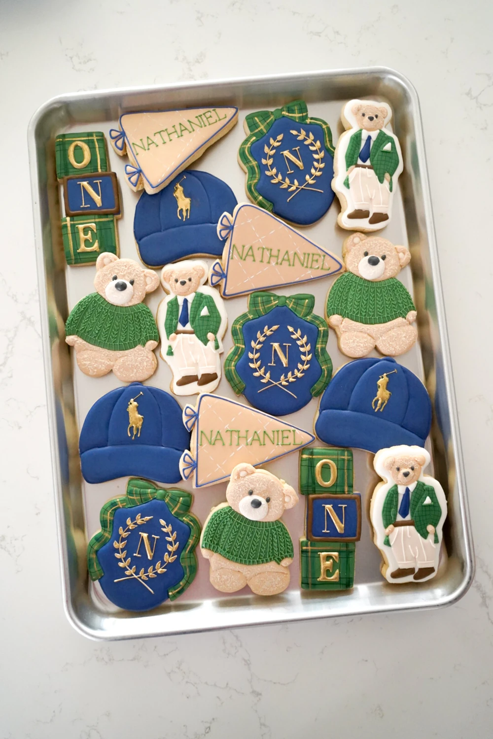 Green and navy first birthday cookies