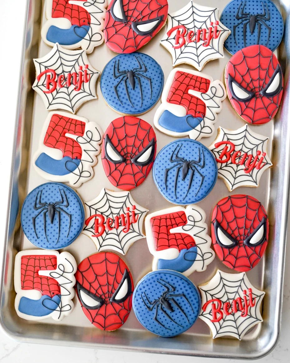 Red and blue Spider-Man fifth birthday cookies