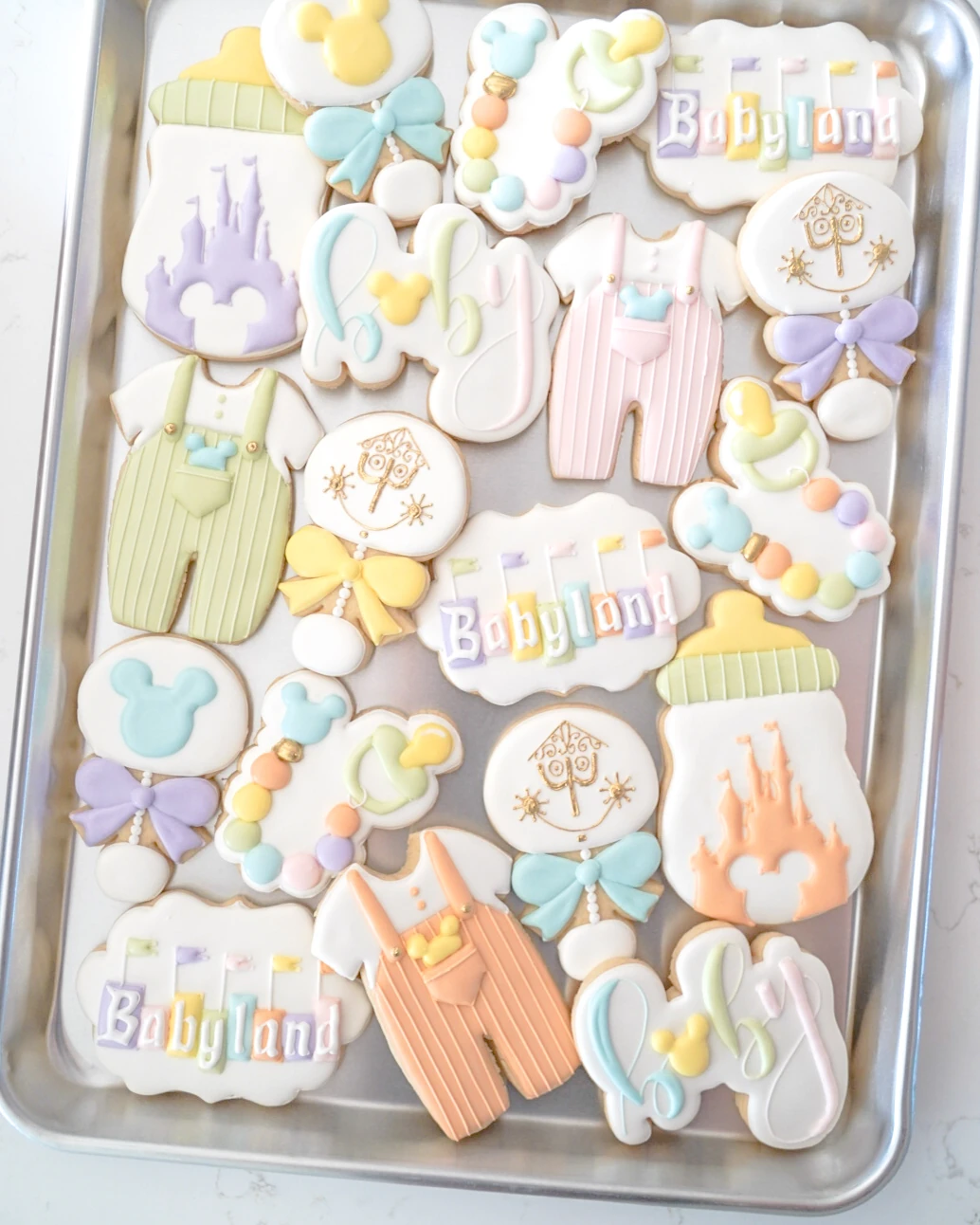 Pastel birthday cookies with cakes and rainbows